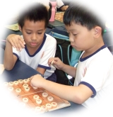Kids playing xiangqi